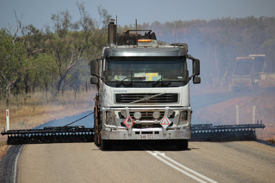 A bitumen spray truck on the Barkly Highway on the NT/ QLD border...