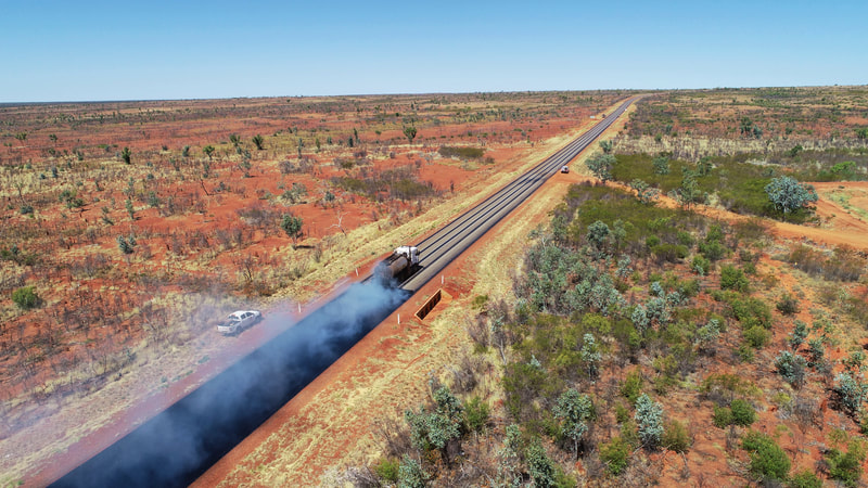 An NT Bitumen Sprayer at work near Alice Springs..